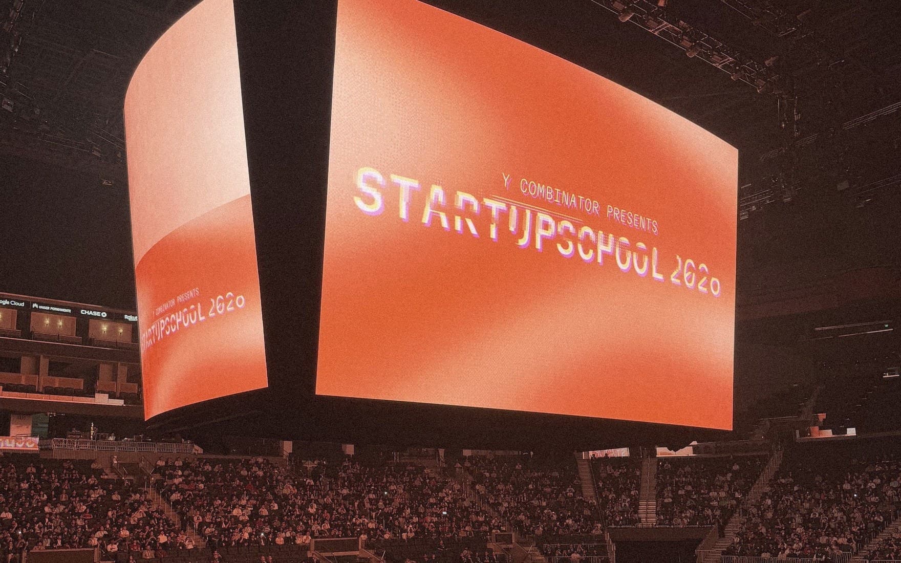 Startup School 2026 on the Chase Center's screens before a talk