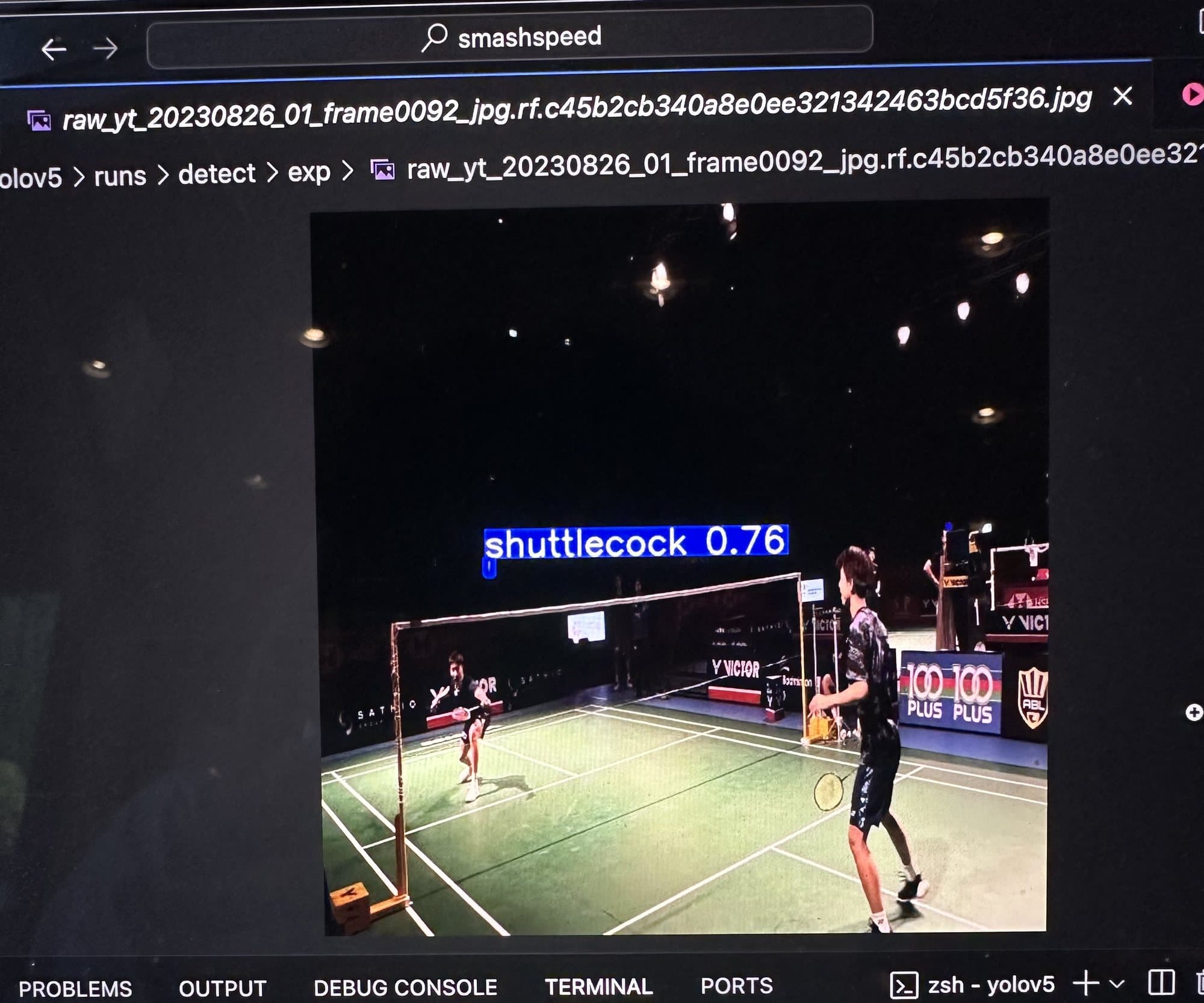 An early YOLOv5 run picking out a shuttlecock at 0.76 confidence in a test frame